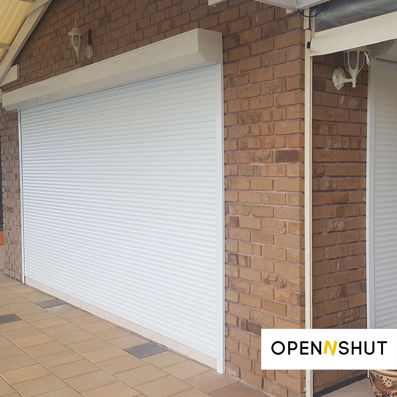 Large White Roller Shutter over Patio Door