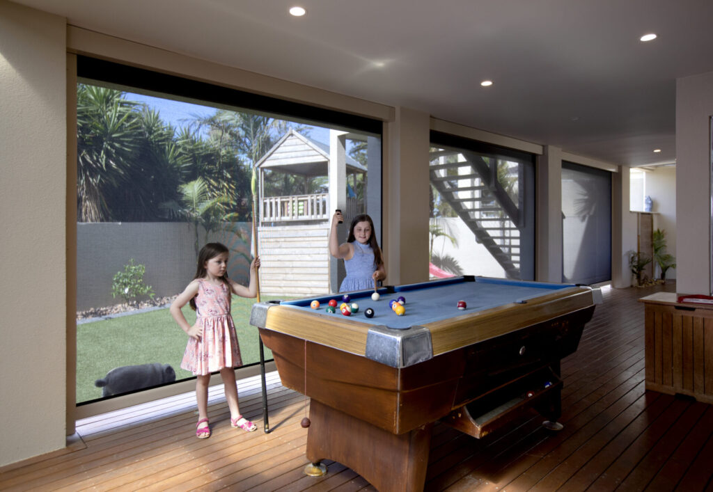 Outdoor gaming area with outdoor blinds