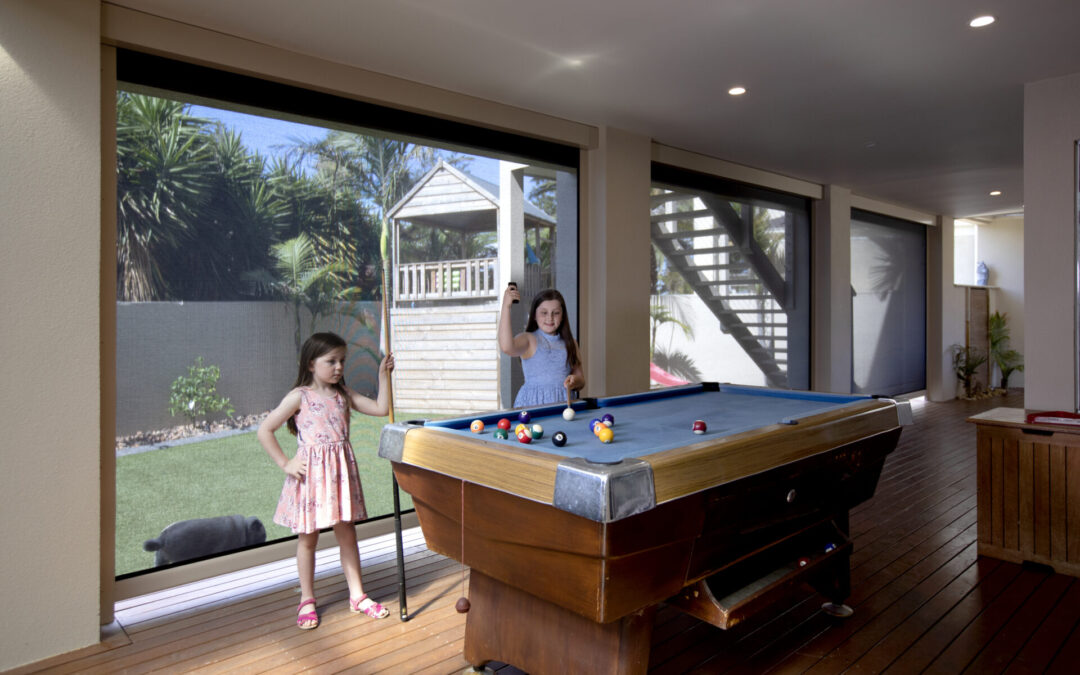 Outdoor gaming area with outdoor blinds