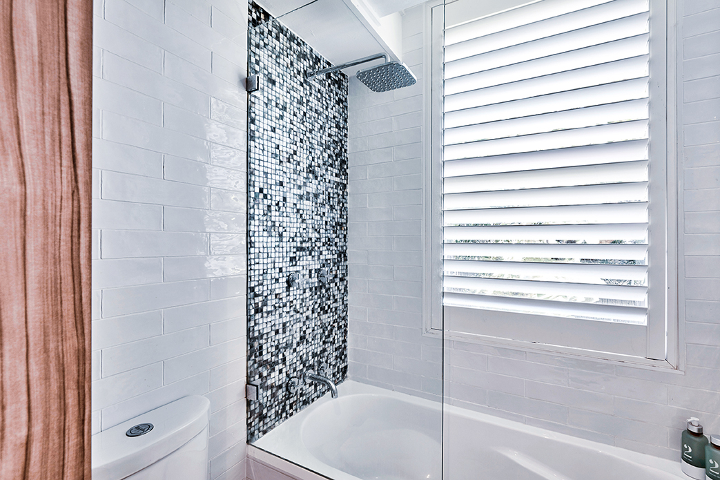 Plantation shutters installed in a bathroom.