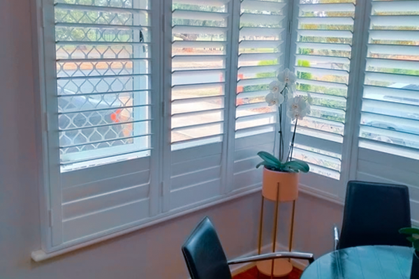 Plantation Shutters installed in a dinning room.