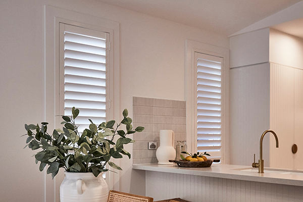 Kitchen with Plantation Shutters installed to control light and privacy.