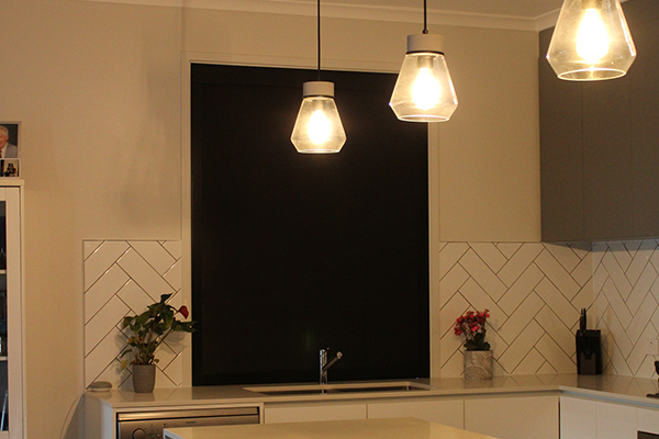 Kitchen with blockout blinds installed for a stylish finishing.