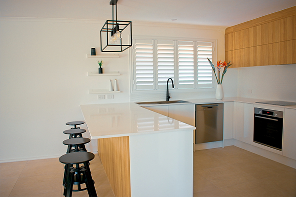 Plantation Shutters installed in a kitchen window.