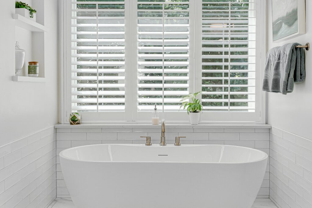 Plantation shutters installed in a bathroom.