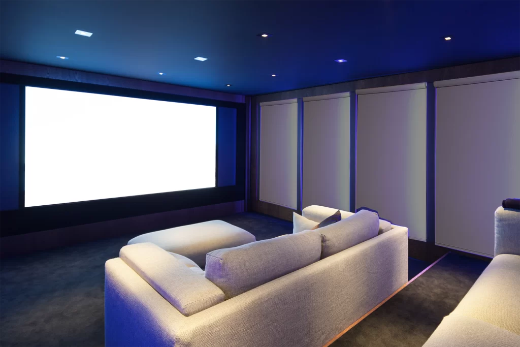 Home theatre with roller blinds installed for the best experience.