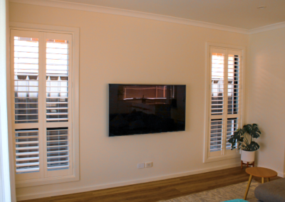 Plantation Shutters installed in a living room providing total light control.